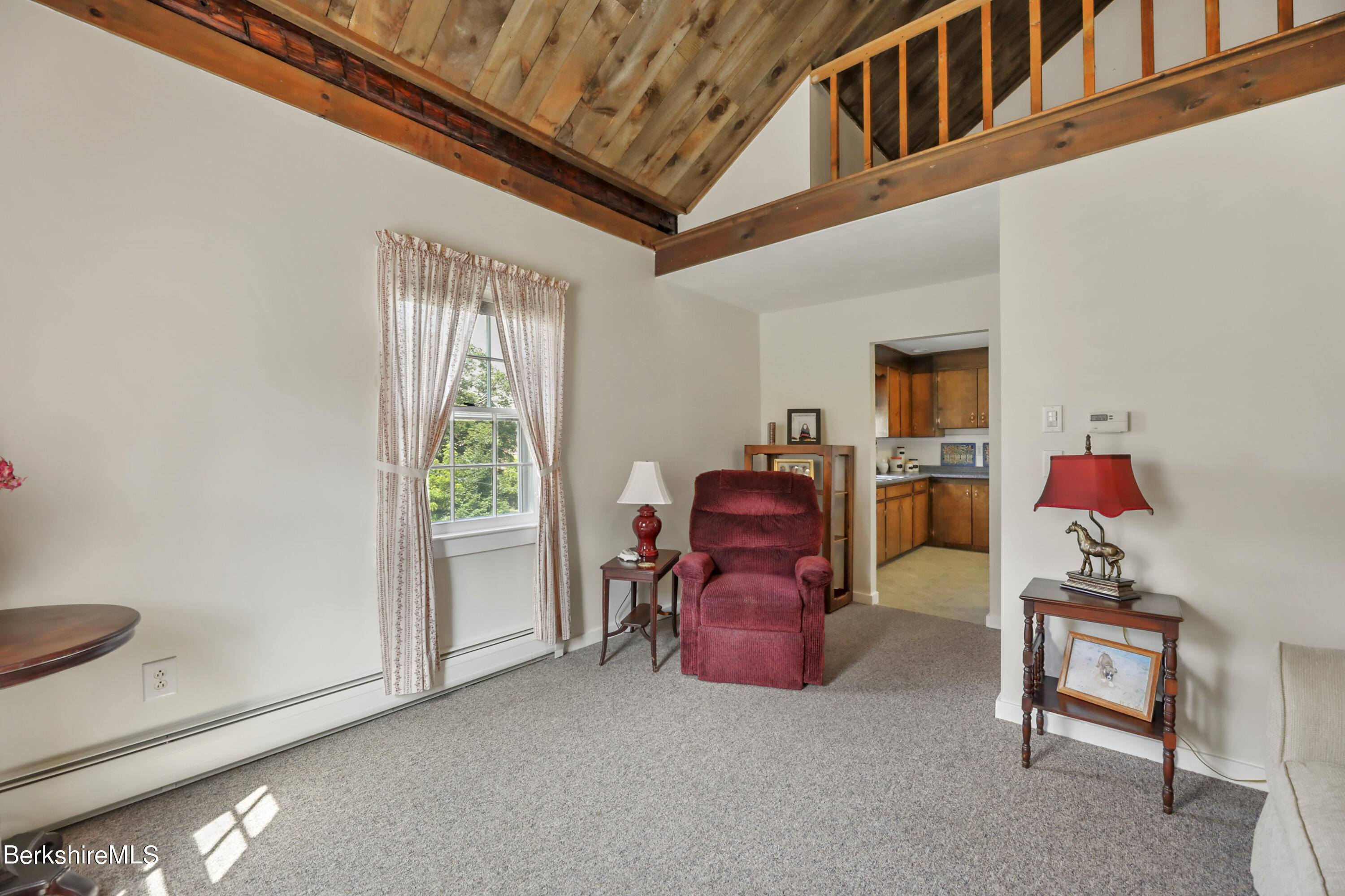 125 Center Street, Unit 2 Lee, MA 01238 - Photo 31 of 39 a living room with furniture a flat screen tv and a window