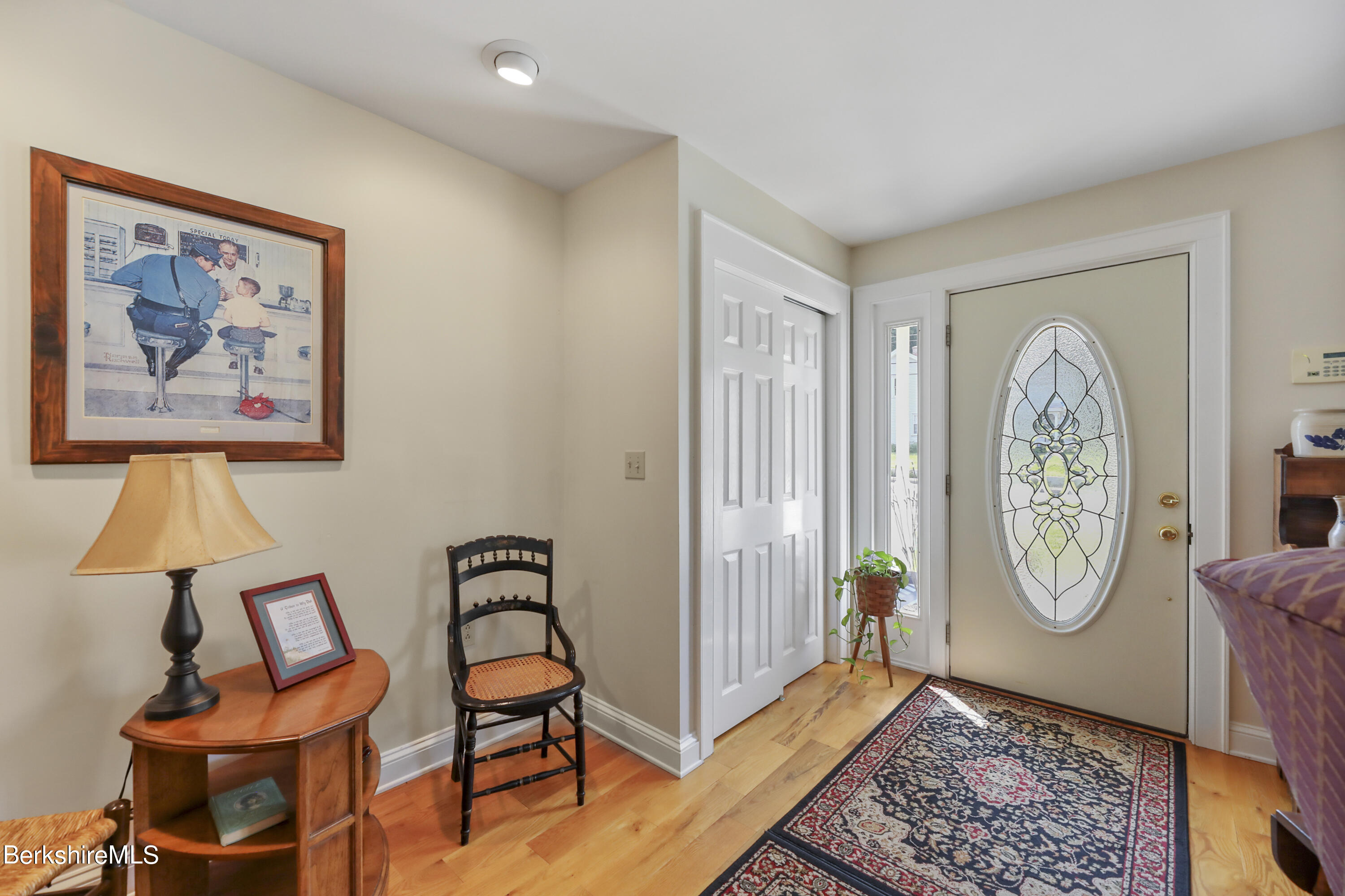 125 Center Street, Unit 2 Lee, MA 01238 - Photo 8 of 39 a view of room with furniture and wooden floor