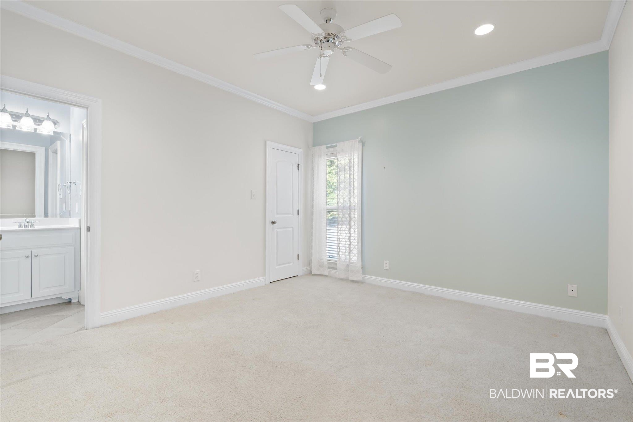 10730 Flagstone Drive Mobile, AL 36608 - Photo 14 of 20 Carpeted spare room with crown molding, sink, and ceiling fan