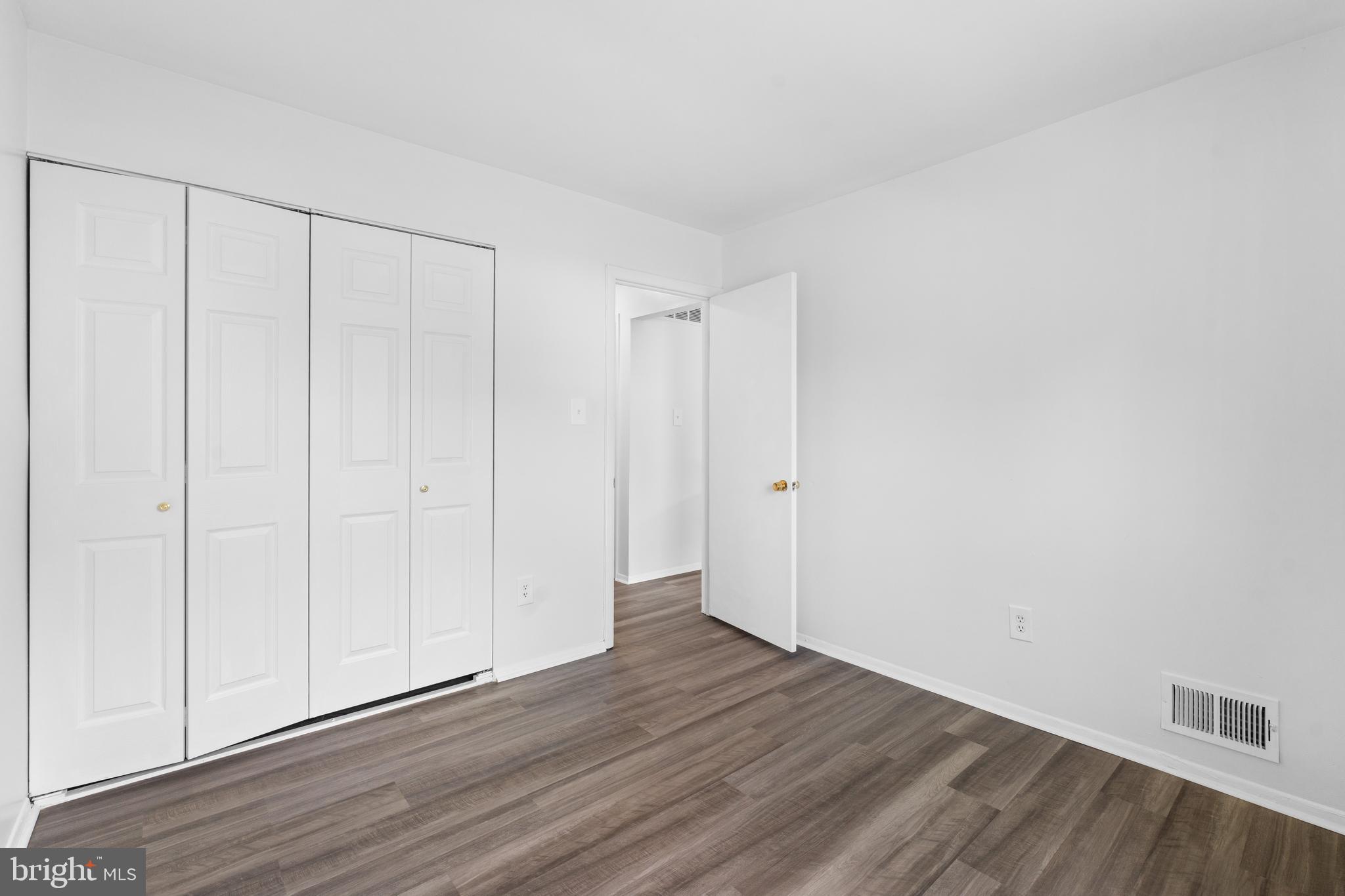 3011 Chester Grove Road, Unit A Upper Marlboro, MD 20774 - Photo 12 of 22 a view of an empty room with wooden floor