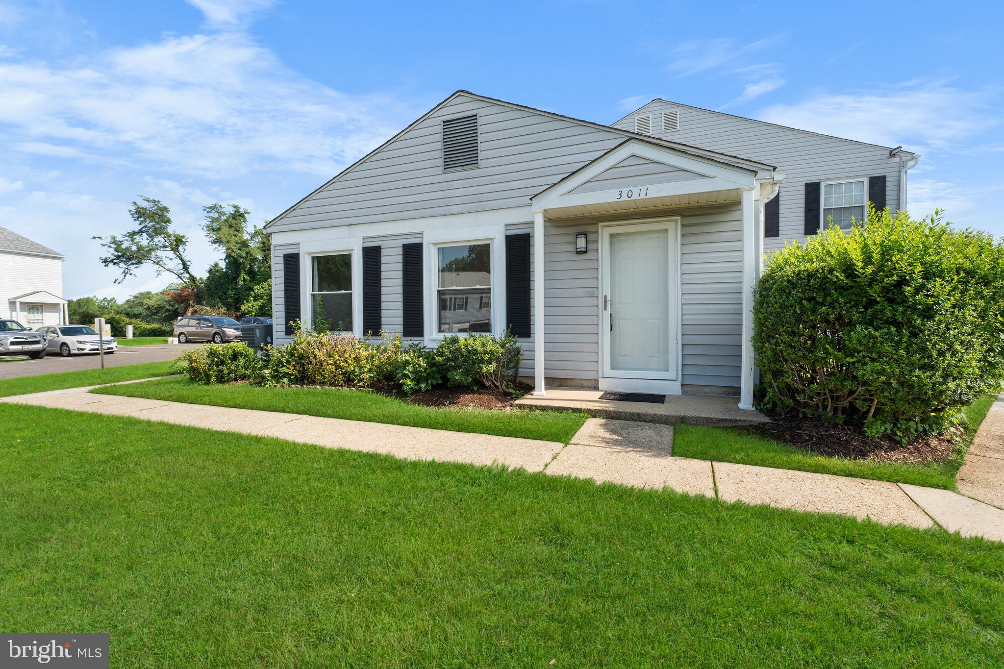 3011 Chester Grove Road, Unit A Upper Marlboro, MD 20774 - Photo 2 of 22 a front view of a house with a yard and porch