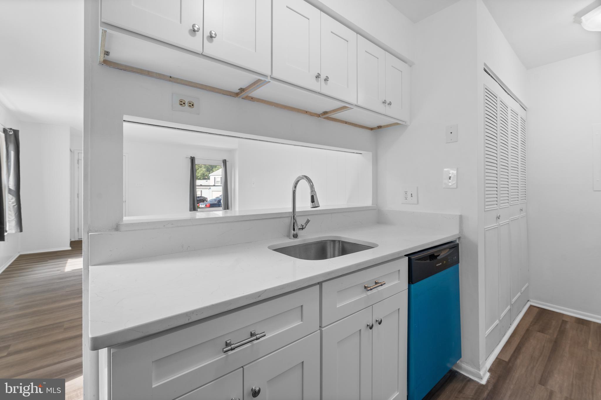 3011 Chester Grove Road, Unit A Upper Marlboro, MD 20774 - Photo 9 of 22 a kitchen with a sink and cabinets