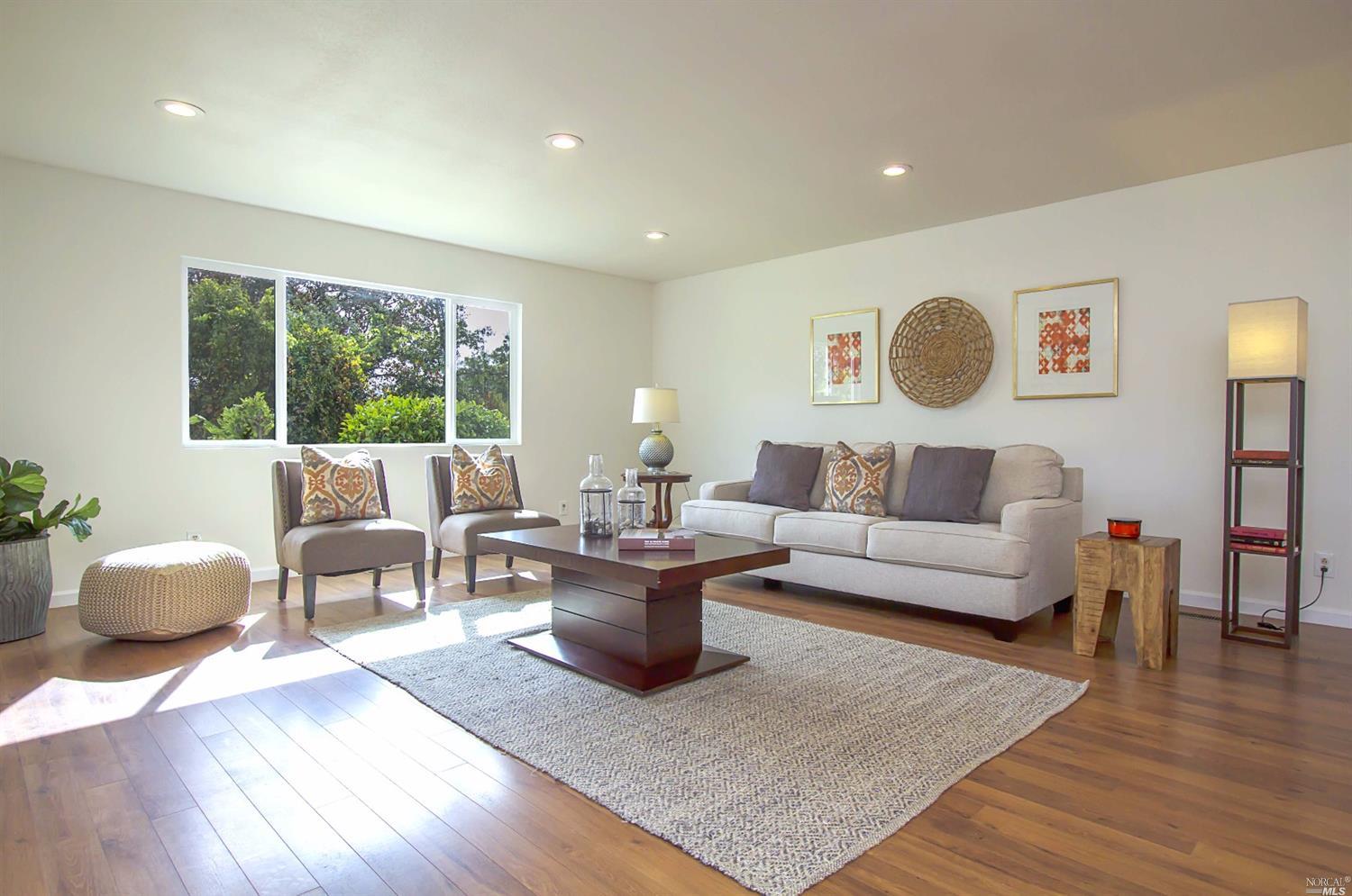 550 Hunter Lane Santa Rosa, CA 95404 - Photo 1 of 1 a living room with furniture and a large window