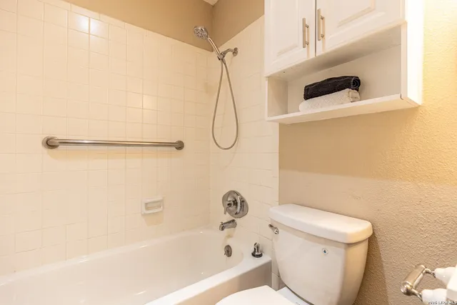 an empty room with wooden floor and a window