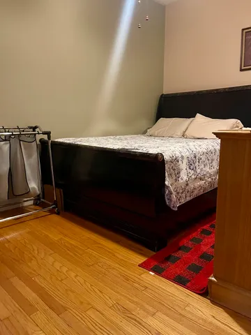 a bedroom with a bed and a fireplace