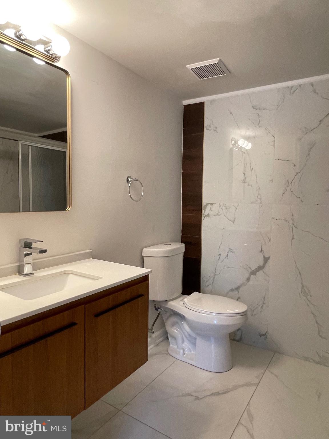 50 Le Forge Court, Unit 50 Chesterbrook, PA 19087 - Photo 12 of 17 a bathroom with a sink toilet and mirror