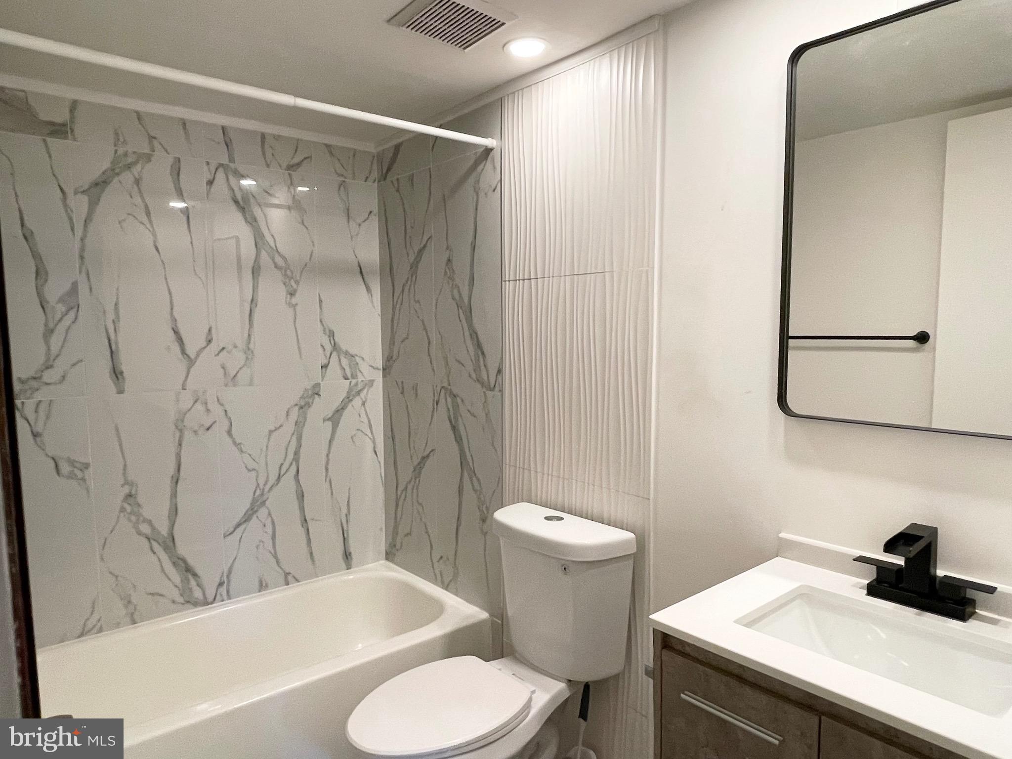 50 Le Forge Court, Unit 50 Chesterbrook, PA 19087 - Photo 8 of 17 a bathroom with a sink toilet and shower