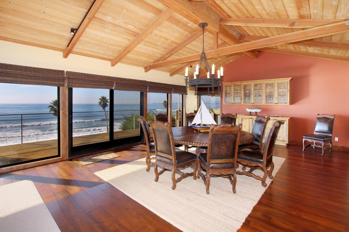 195 Vía Concha Aptos, CA 95003 - Photo 22 of 50 a dining room with furniture a chandelier and wooden floor