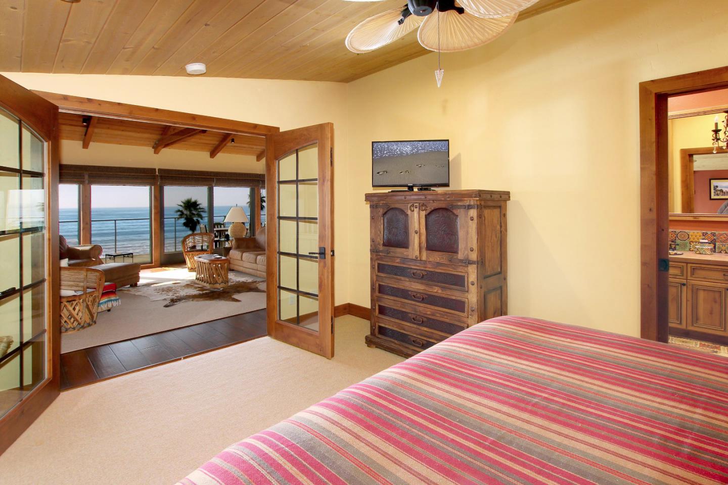 195 Vía Concha Aptos, CA 95003 - Photo 29 of 50 a bedroom with a bed and wooden floor