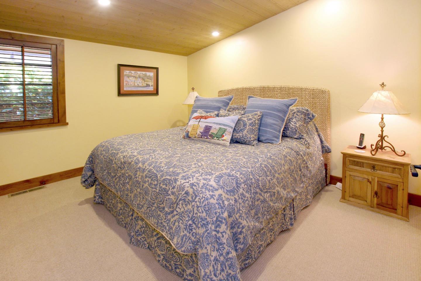 195 Vía Concha Aptos, CA 95003 - Photo 37 of 50 a bedroom with a bed and a chandelier