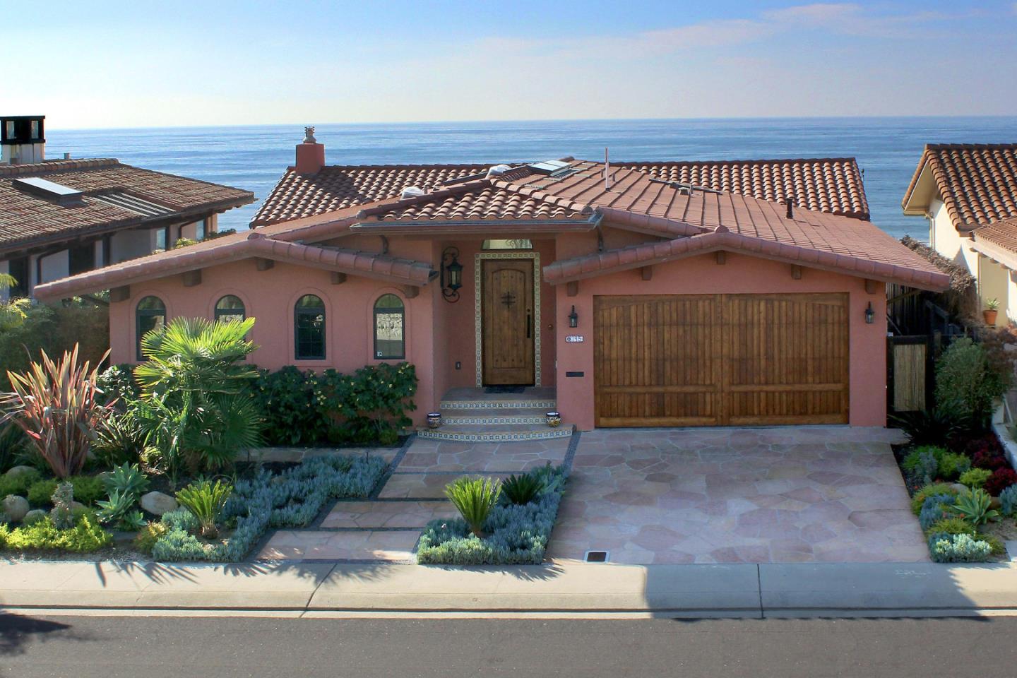 195 Vía Concha Aptos, CA 95003 - Photo 4 of 50 a view of a house with a potted plant and floor to ceiling window and potted plants