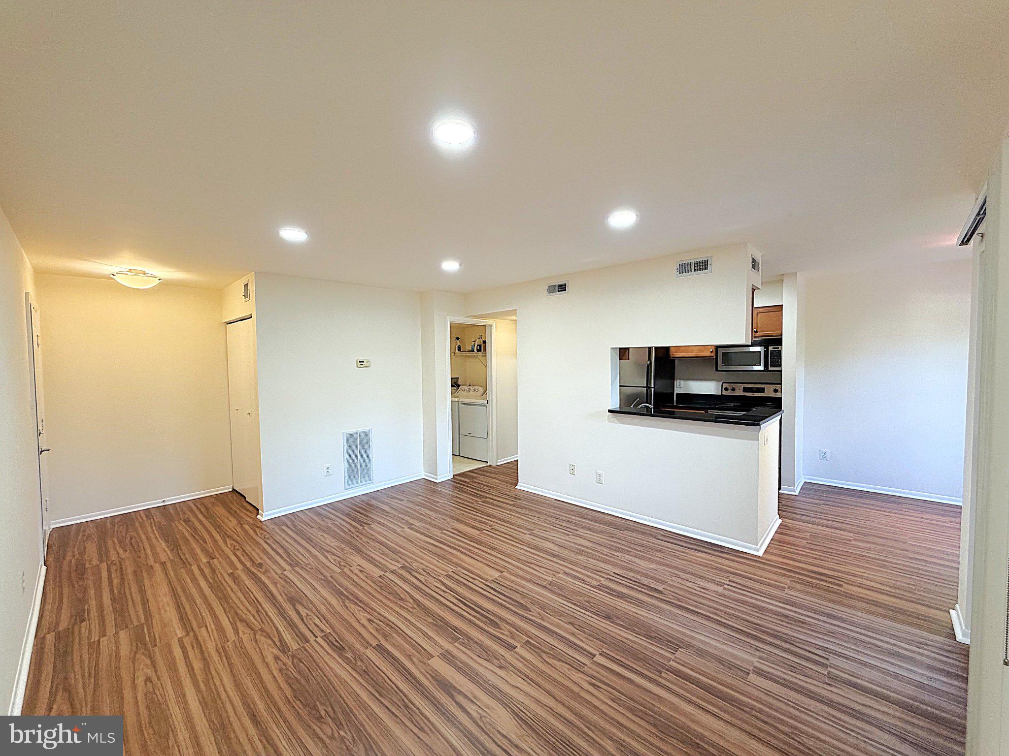 11653 Gas Light Court, Unit H Reston, VA 20190 - Photo 8 of 28 Spacious, modern living area awaits you.