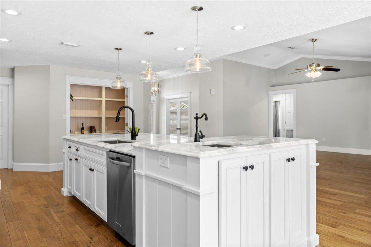 7584 Woodmont Road Navarre, FL 32566 - Photo 11 of 62 a kitchen with a sink and cabinets