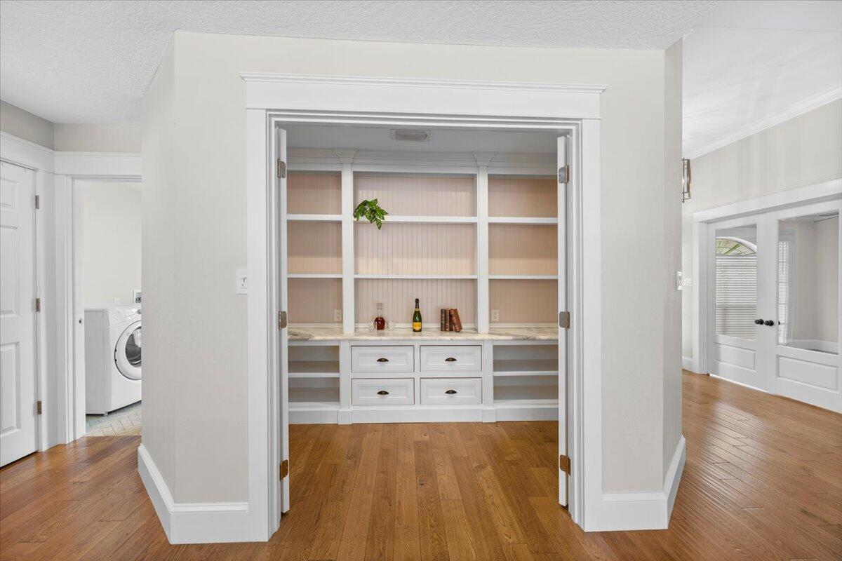 7584 Woodmont Road Navarre, FL 32566 - Photo 15 of 62 a view of a room with wooden floor and closet