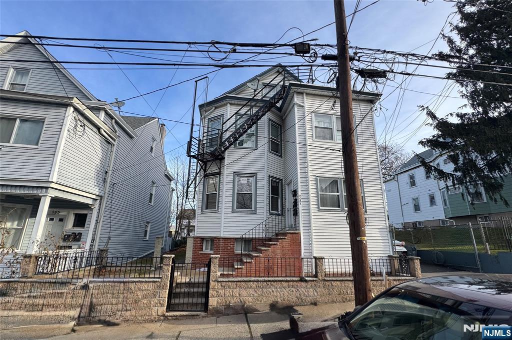 a view of a house with a street