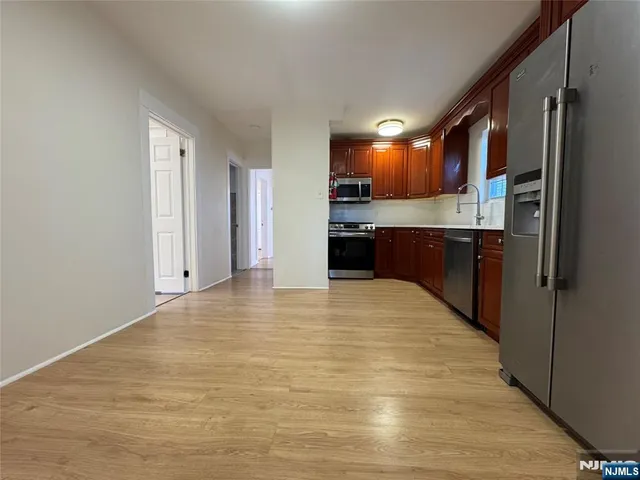 a view of a kitchen with a sink