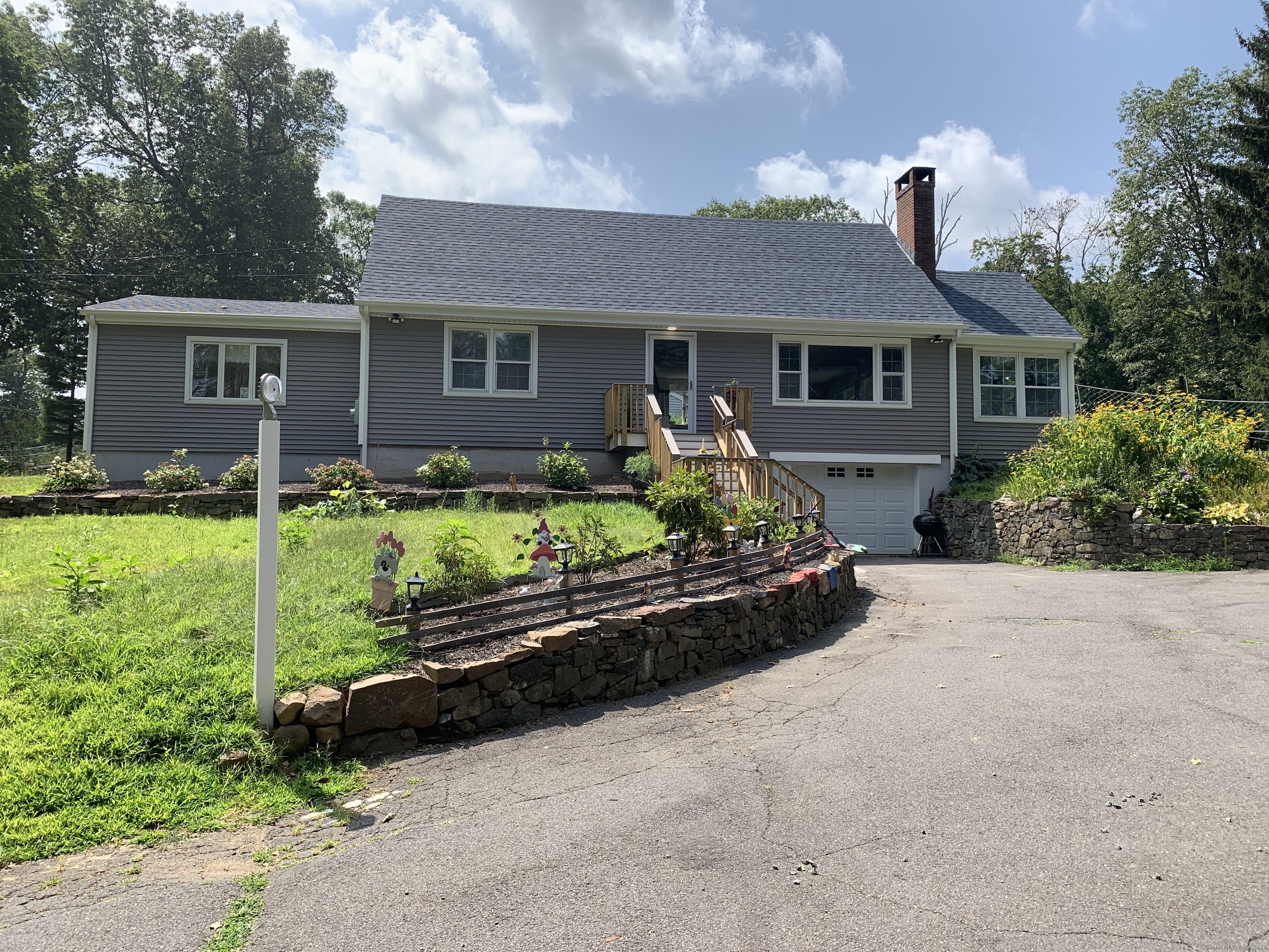78 Birdseye Road Farmington, CT 06032 - Photo 1 of 28 a front view of a house with a yard