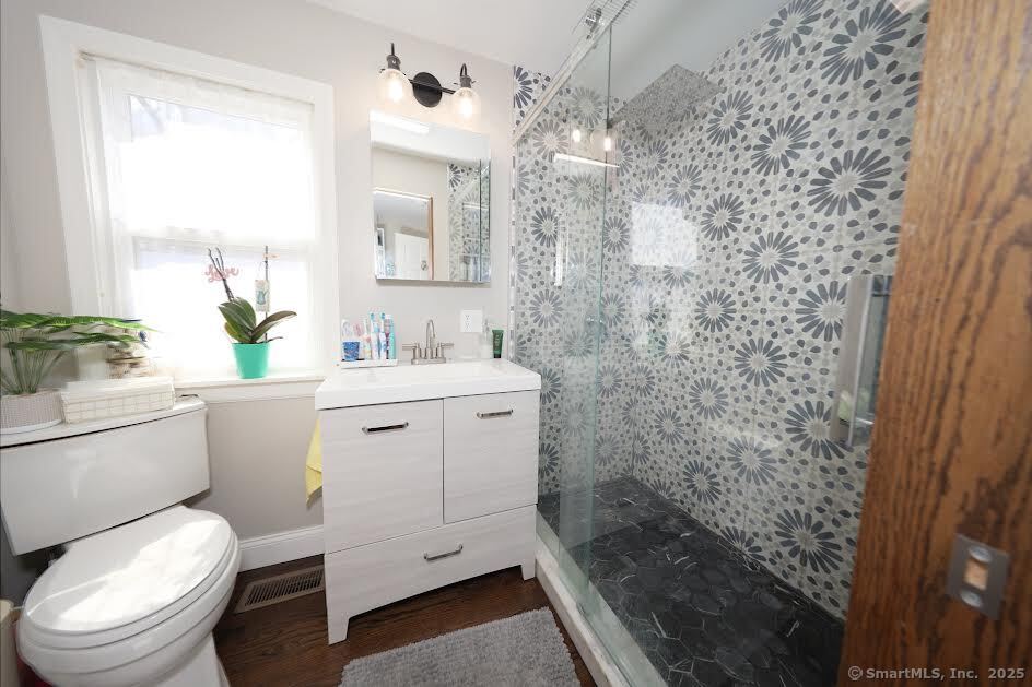 78 Birdseye Road Farmington, CT 06032 - Photo 14 of 28 a bathroom with a granite countertop toilet sink and mirror