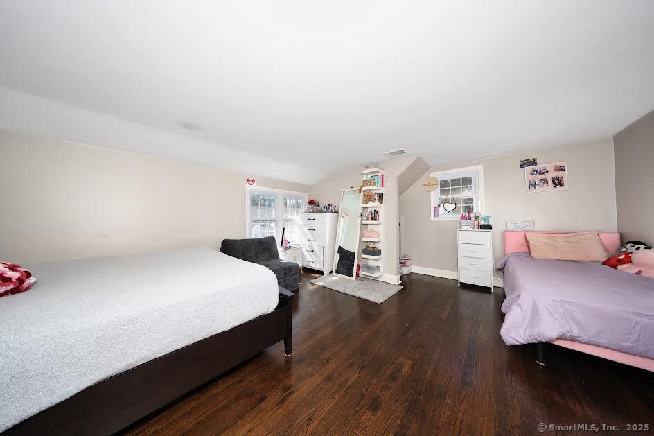 78 Birdseye Road Farmington, CT 06032 - Photo 17 of 28 a bedroom with a bed and wooden floor