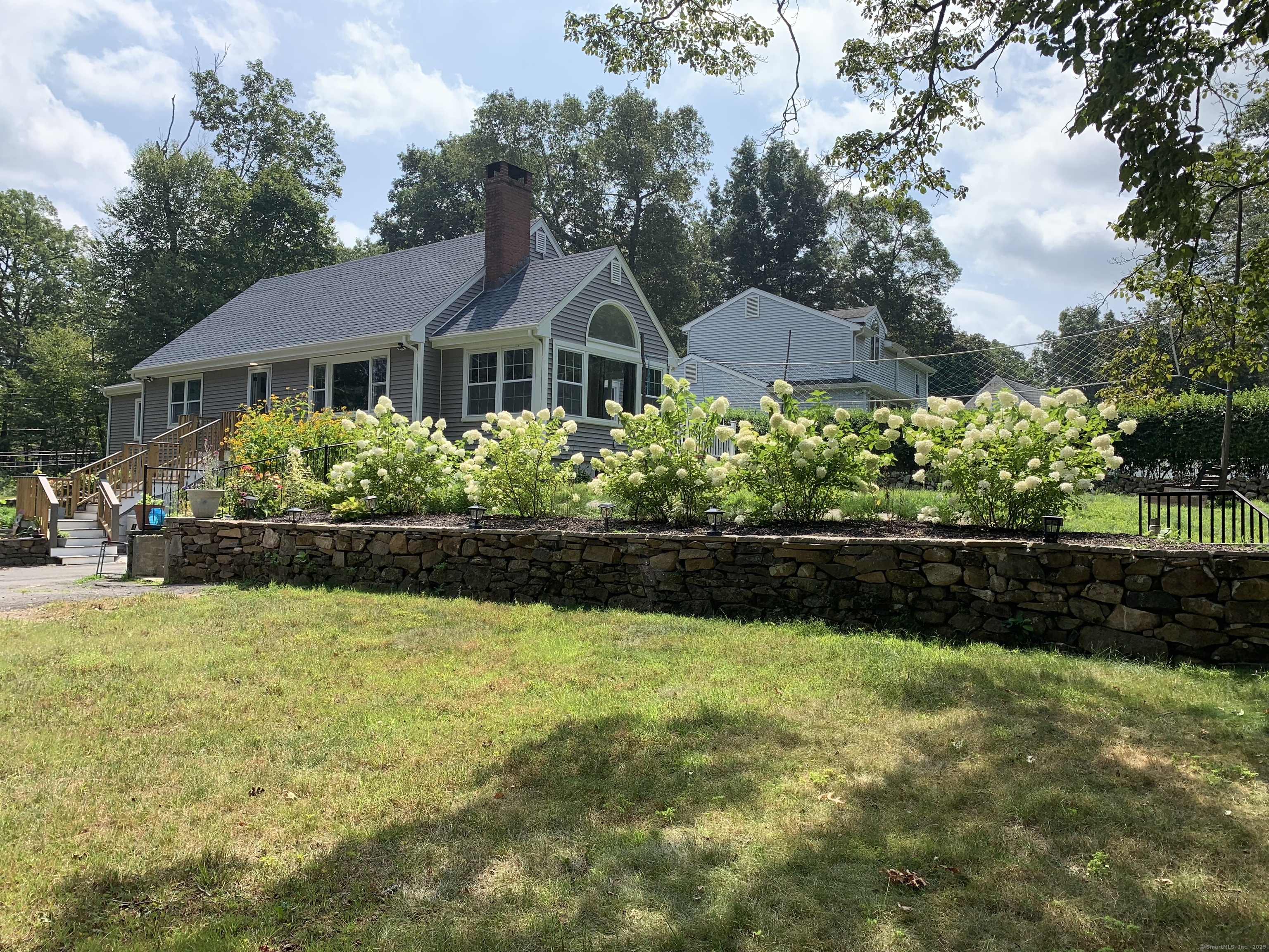 78 Birdseye Road Farmington, CT 06032 - Photo 2 of 28 a front view of a house with a swimming pool