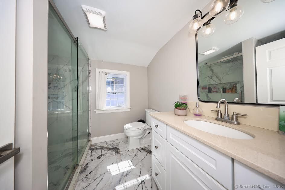 78 Birdseye Road Farmington, CT 06032 - Photo 22 of 28 a bathroom with a double vanity sink toilet and shower