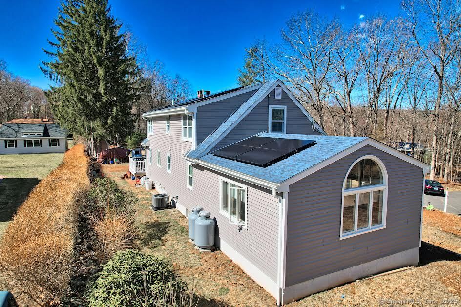 78 Birdseye Road Farmington, CT 06032 - Photo 26 of 28 a front view of a house with a yard