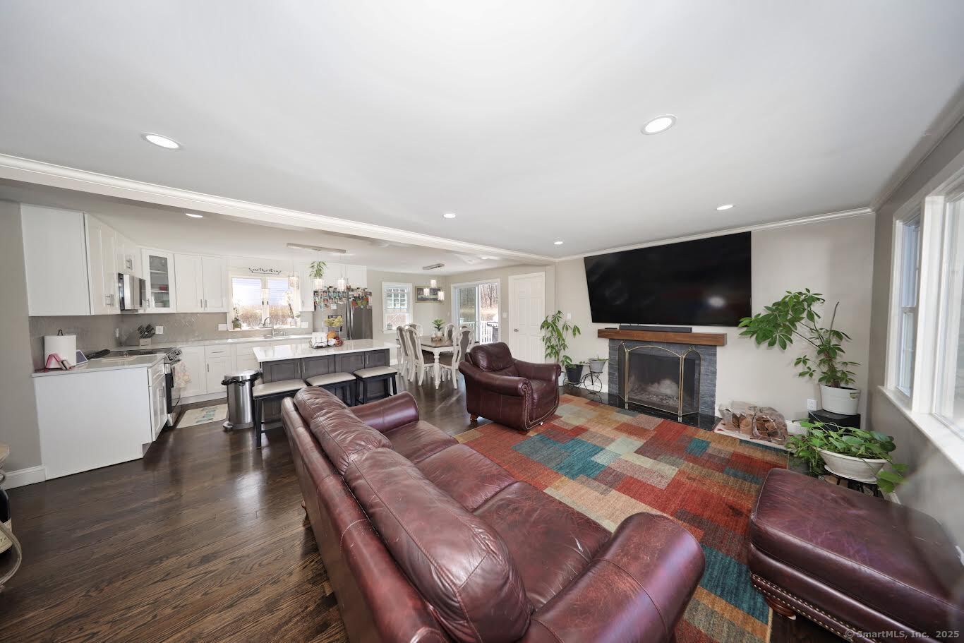 78 Birdseye Road Farmington, CT 06032 - Photo 4 of 28 a living room with furniture a fireplace and a flat screen tv
