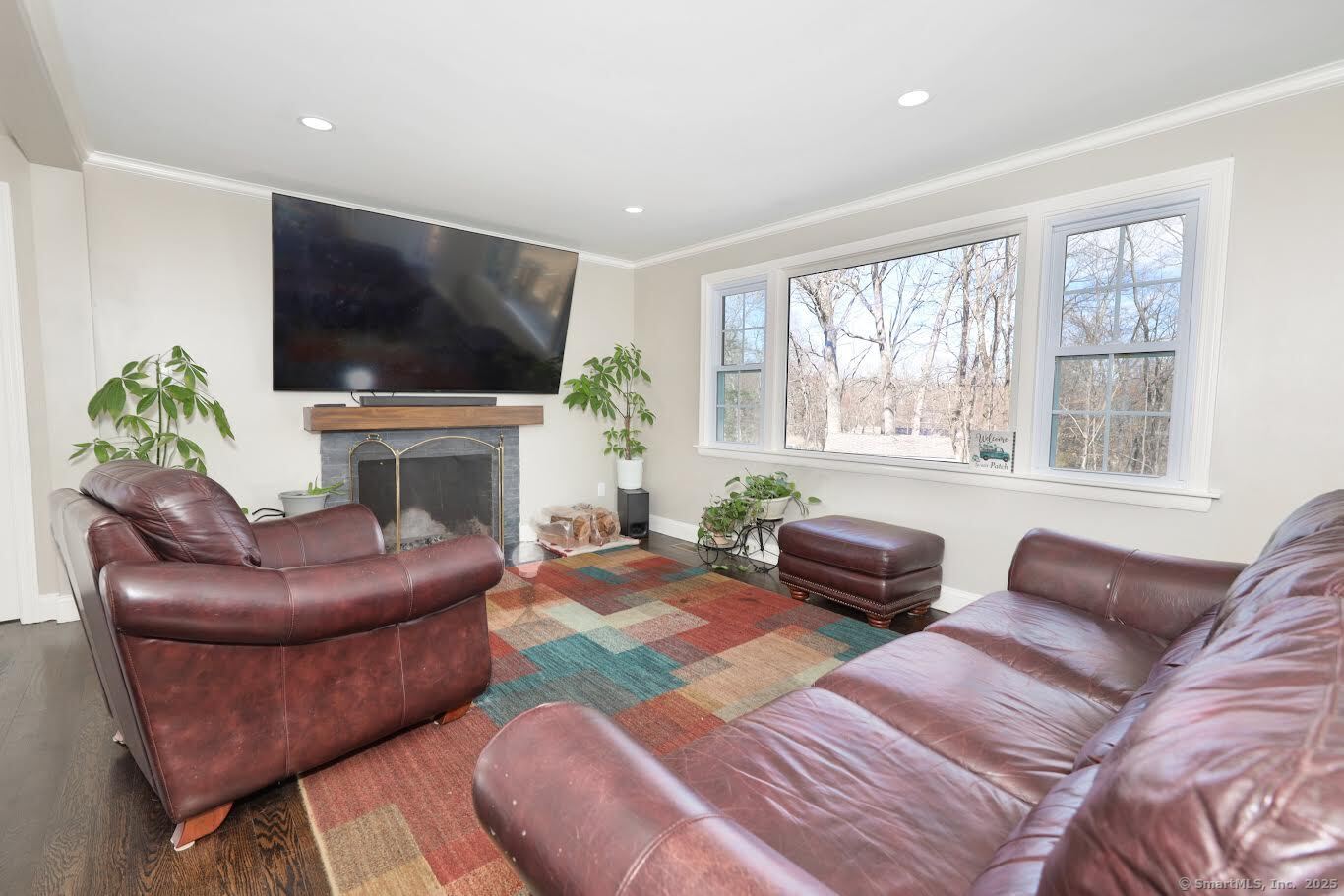 78 Birdseye Road Farmington, CT 06032 - Photo 5 of 28 a living room with furniture a flat screen tv and a large window