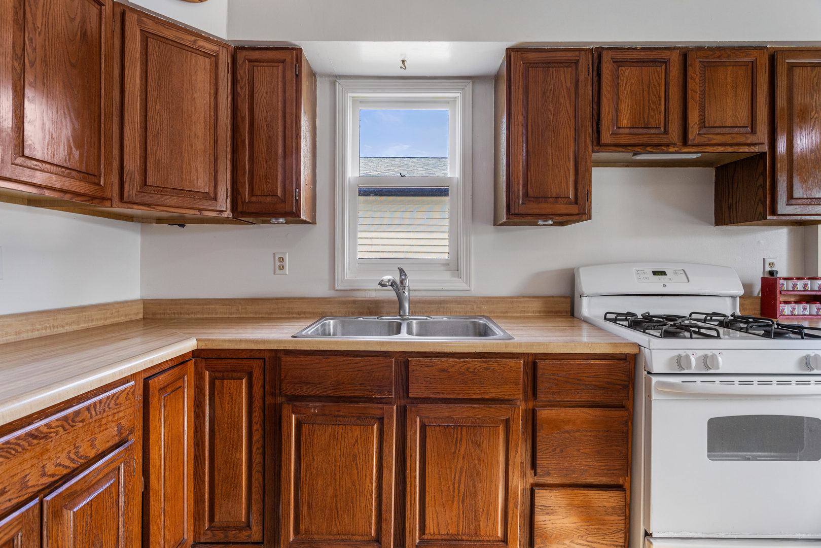 506 East State Street Mahomet, IL 61853 - Photo 12 of 36 a kitchen with stainless steel appliances granite countertop a sink stove and cabinets