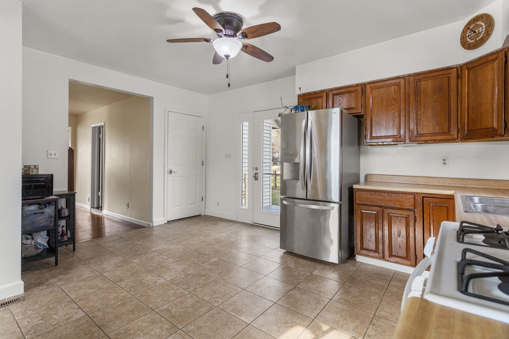 506 East State Street Mahomet, IL 61853 - Photo 13 of 36 a kitchen with stainless steel appliances a refrigerator and a stove top oven