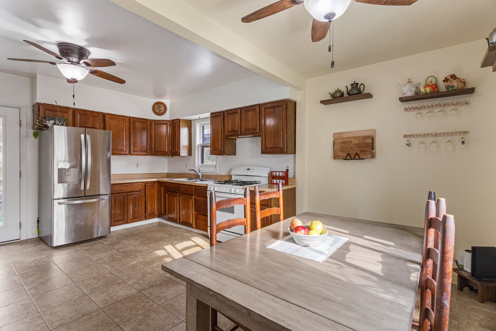 506 East State Street Mahomet, IL 61853 - Photo 17 of 36 a kitchen with stainless steel appliances granite countertop a refrigerator and a stove top oven