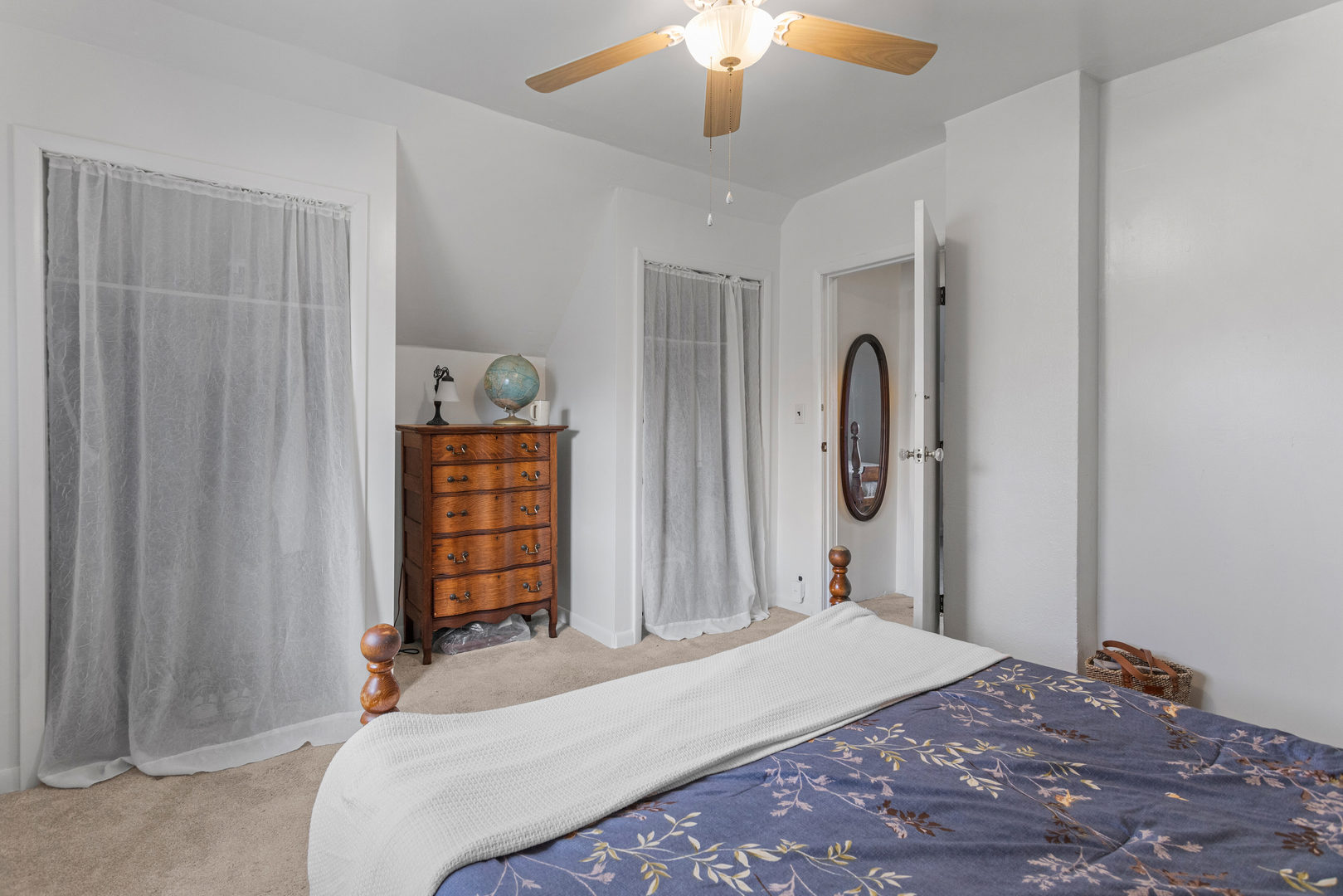 506 East State Street Mahomet, IL 61853 - Photo 27 of 36 a bedroom with a bed and a chandelier
