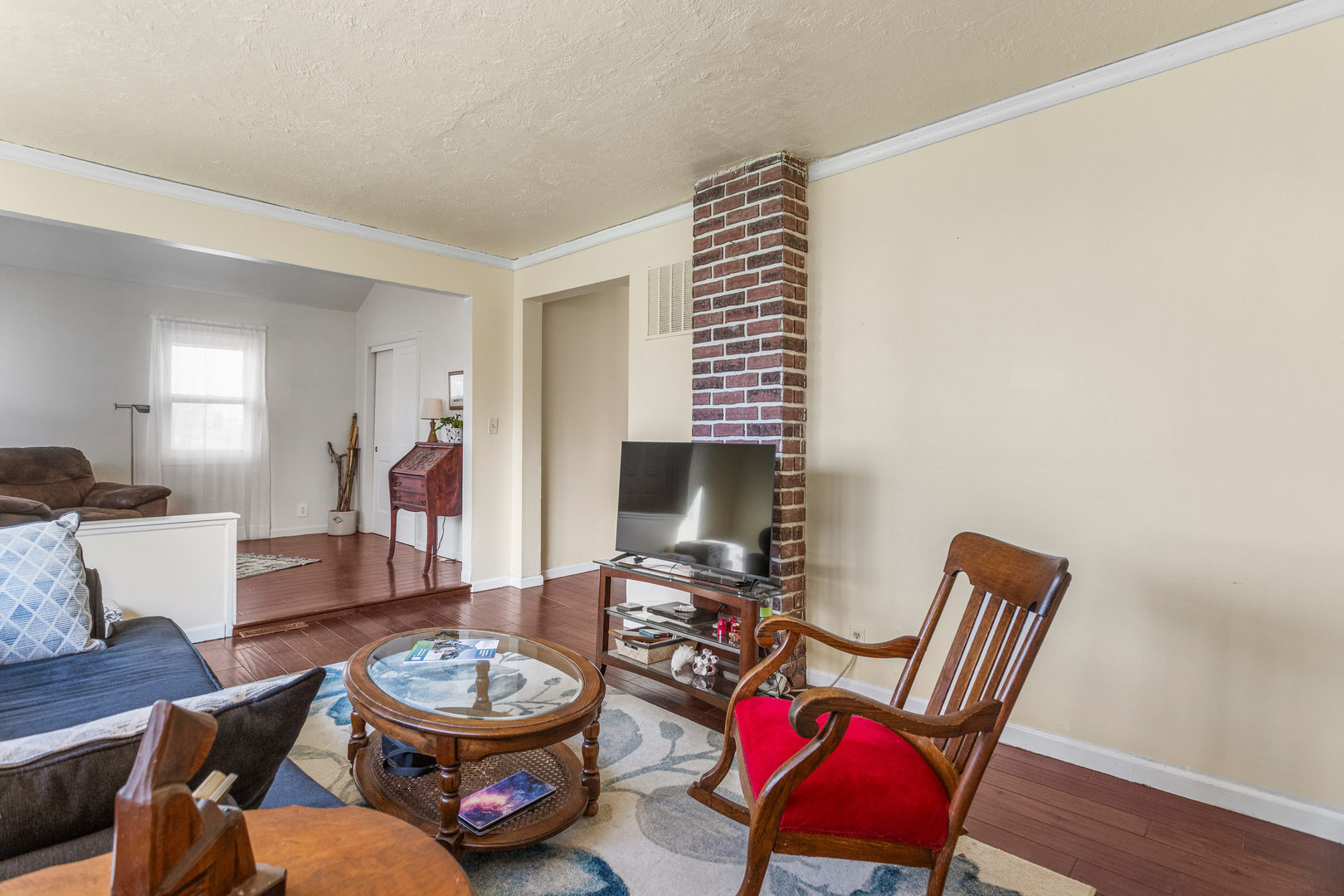 506 East State Street Mahomet, IL 61853 - Photo 10 of 36 a living room with furniture and a chair