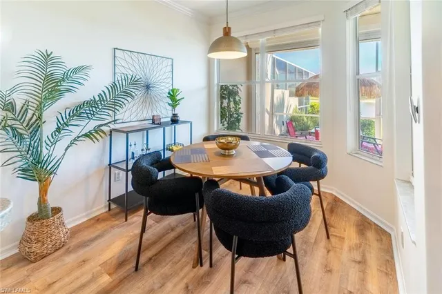 a dining room with furniture and window