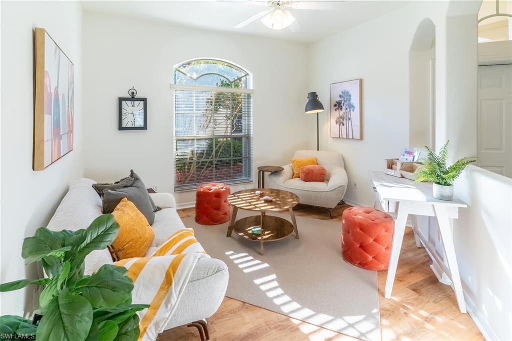 1896 Crestview Way Naples, FL 34119 - Photo 15 of 38 a living room with furniture toys and a large window