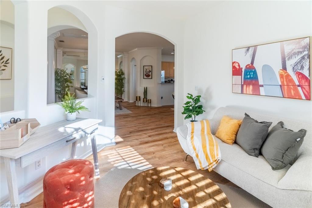 1896 Crestview Way Naples, FL 34119 - Photo 16 of 38 a living room with furniture and a potted plant