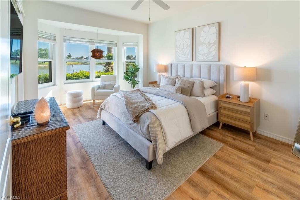 1896 Crestview Way Naples, FL 34119 - Photo 17 of 38 a bed room with a bed and a large window