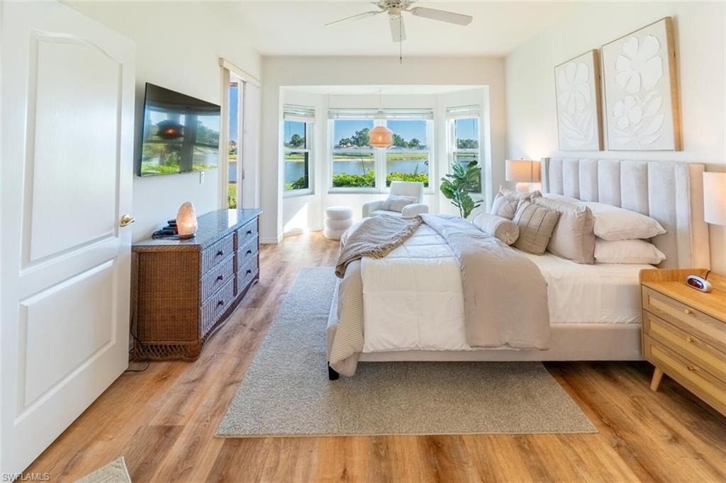 1896 Crestview Way Naples, FL 34119 - Photo 19 of 38 a living room with furniture and a large window