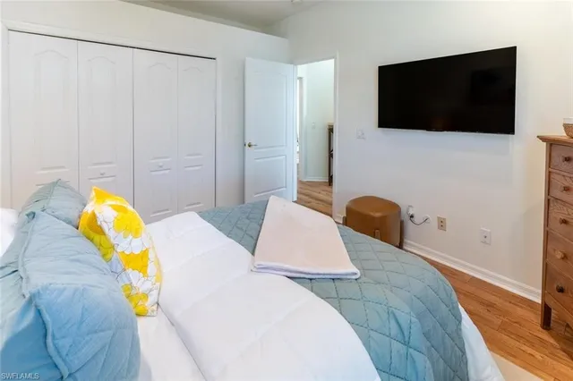 a living room with a flat screen tv and a couch