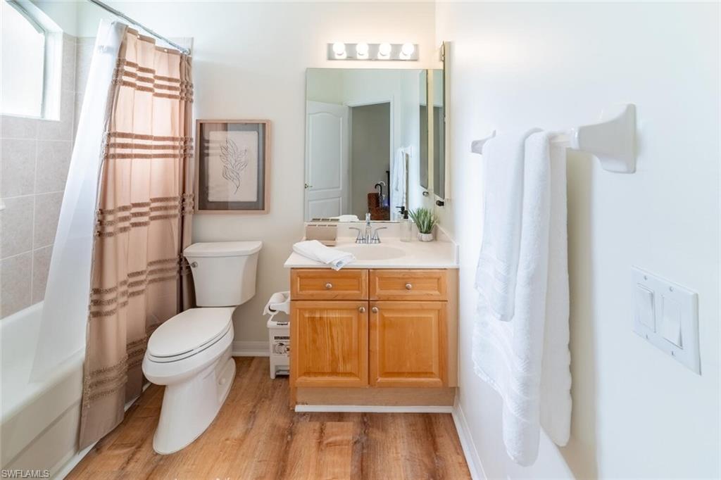 1896 Crestview Way Naples, FL 34119 - Photo 27 of 38 a bathroom with a sink toilet and shower