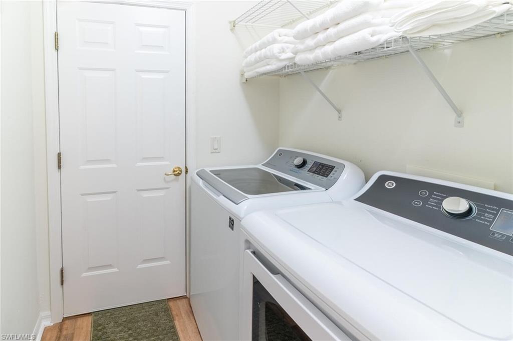 1896 Crestview Way Naples, FL 34119 - Photo 29 of 38 a utility room with dryer and washer