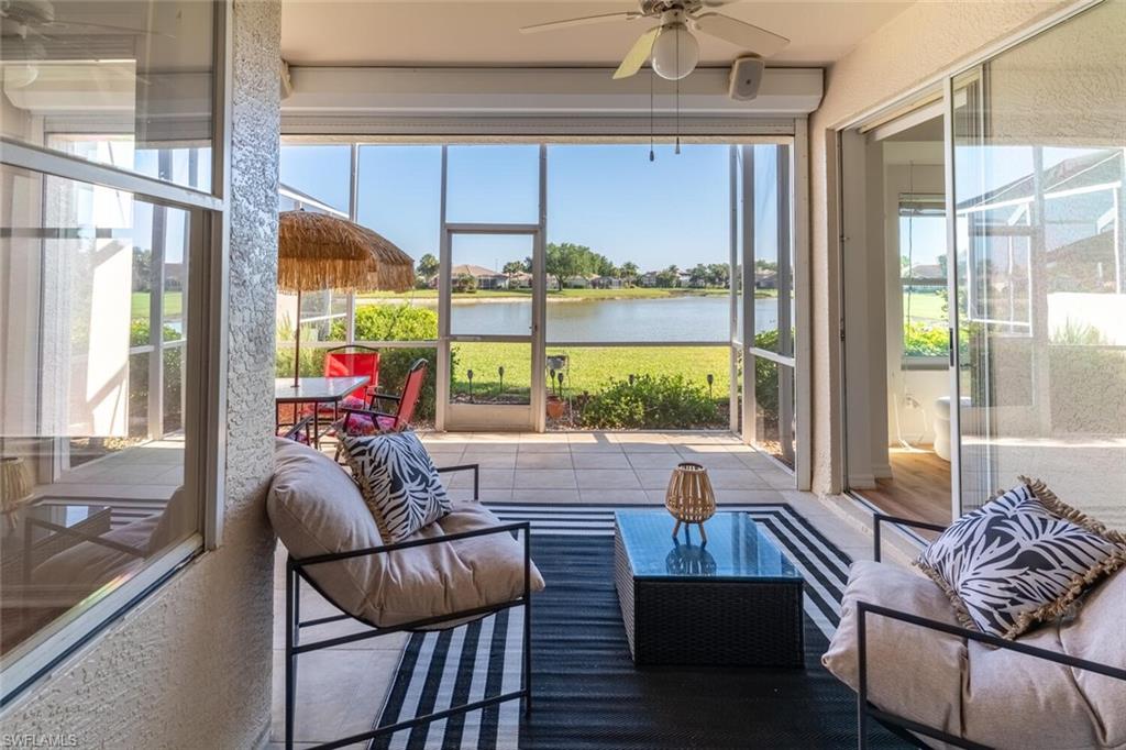 1896 Crestview Way Naples, FL 34119 - Photo 30 of 38 a living room with furniture and a large window