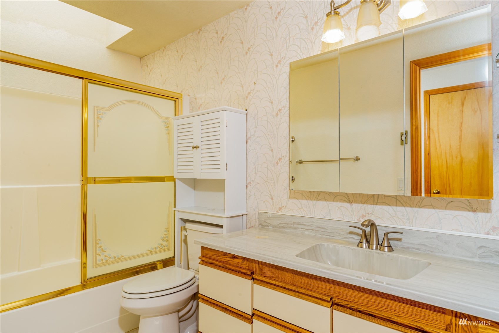 2230 West Valley Road Chimacum, WA 98325 - Photo 12 of 22 a bathroom with a sink and a mirror