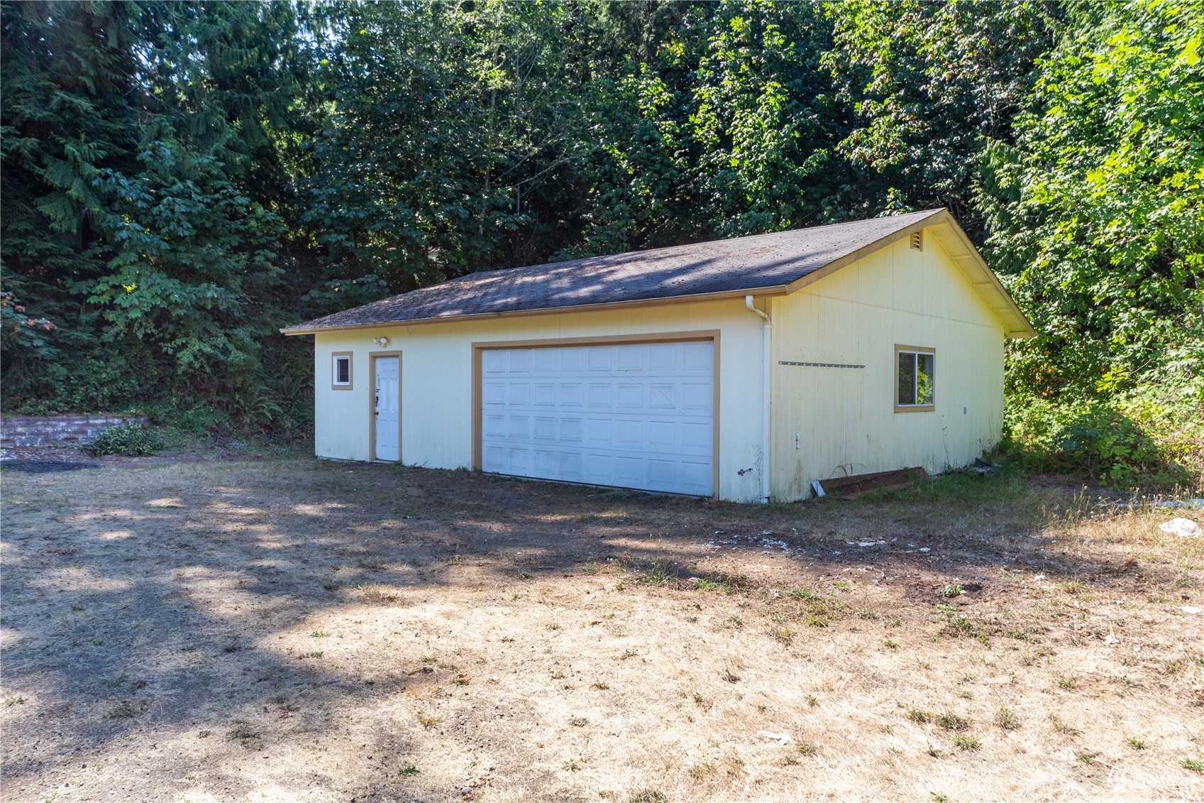 2230 West Valley Road Chimacum, WA 98325 - Photo 16 of 22 a house with trees in the background