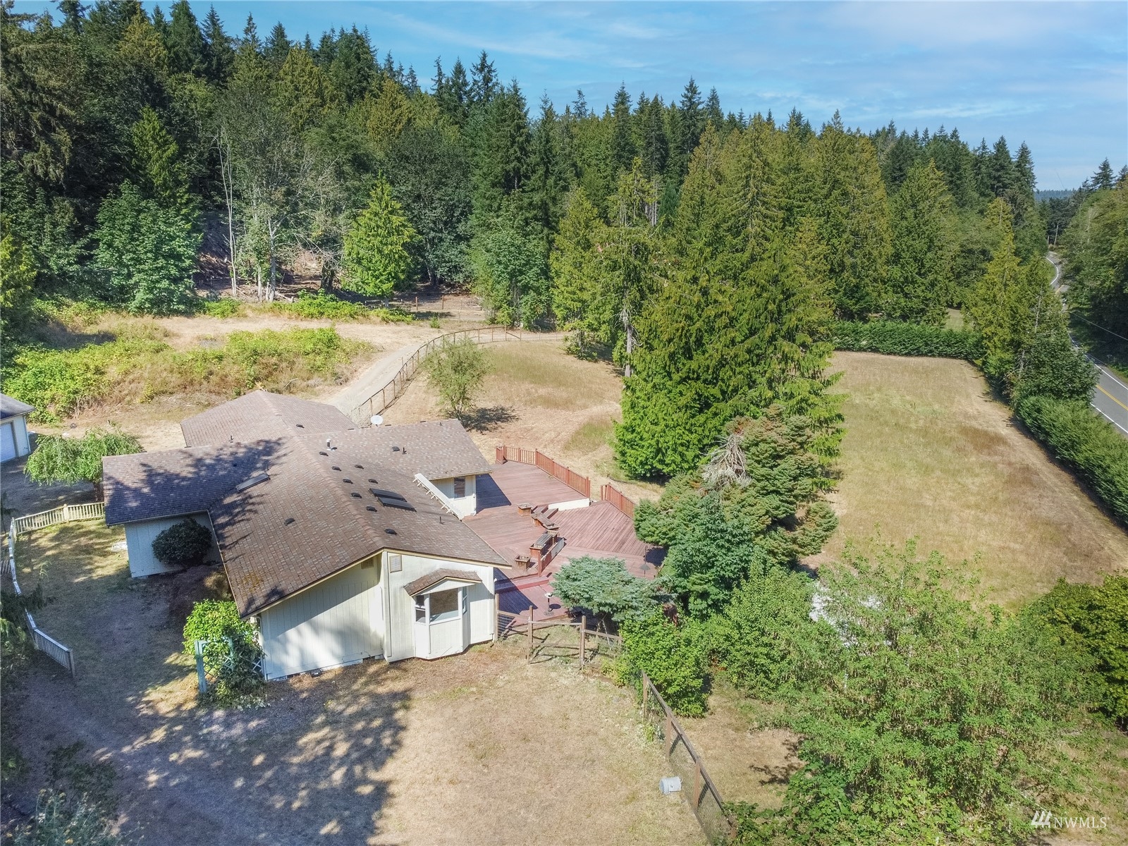 2230 West Valley Road Chimacum, WA 98325 - Photo 19 of 22 an aerial view of a house with yard and trees in the back