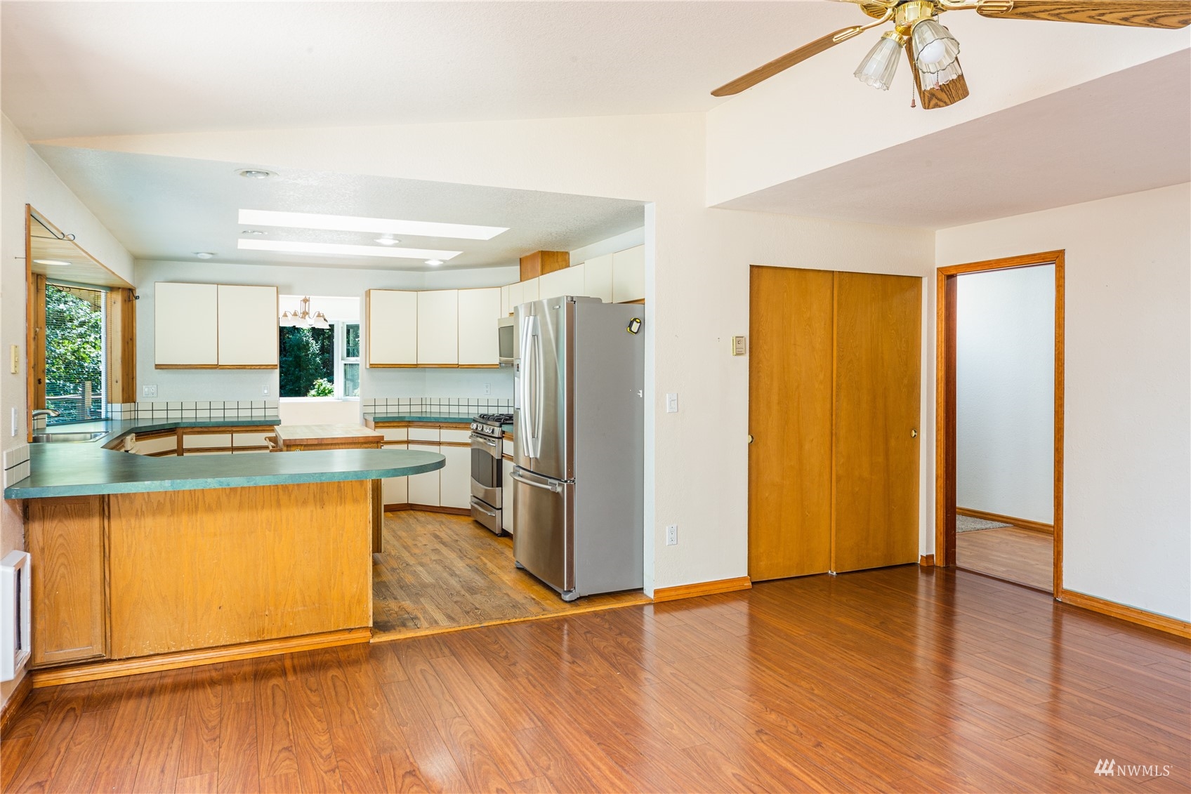 2230 West Valley Road Chimacum, WA 98325 - Photo 4 of 22 a kitchen with stainless steel appliances granite countertop a refrigerator and a stove top oven