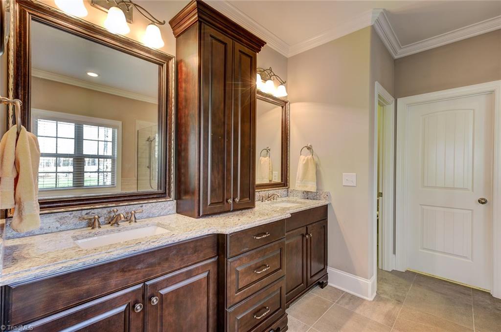 7500 Hearthridge Court Oak Ridge, NC 27310 - Photo 16 of 30 Master bathroom with dual granite vanity.