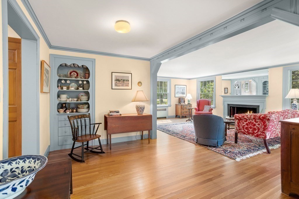 14 Rainbow Road Marblehead, MA 01945 - Photo 14 of 41 a living room with fireplace furniture and a wooden floor