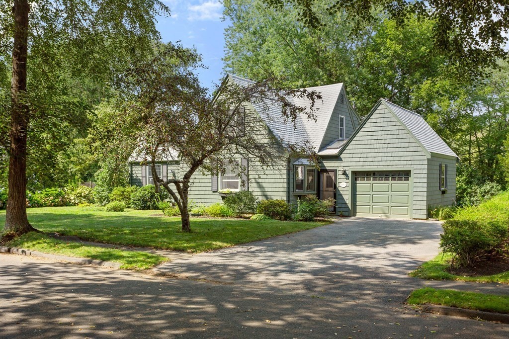 14 Rainbow Road Marblehead, MA 01945 - Photo 2 of 41 a front view of a house with a garden and trees