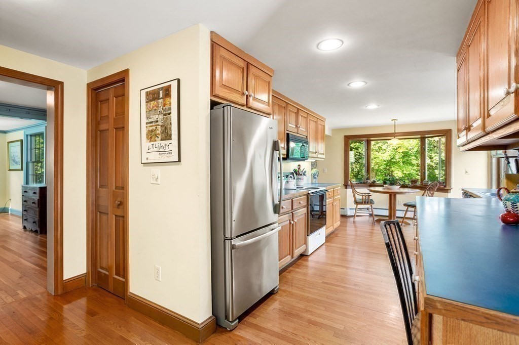 14 Rainbow Road Marblehead, MA 01945 - Photo 22 of 41 a kitchen with stainless steel appliances granite countertop a refrigerator a oven a stove and a refrigerator with wooden floor